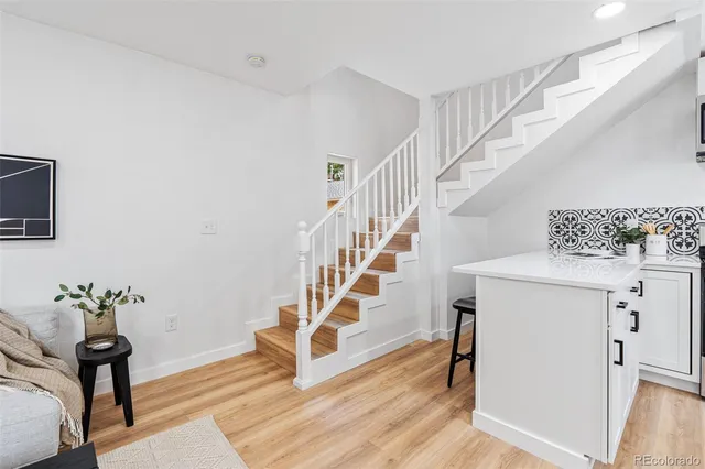 a view of entryway with wooden floor and stairs