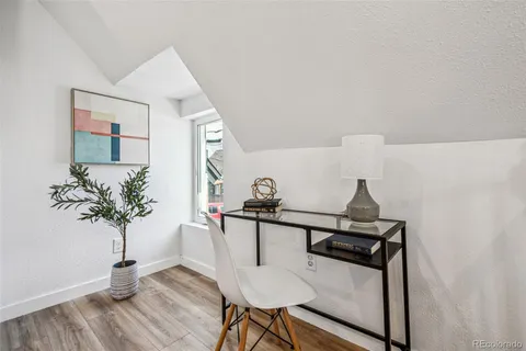 a view of a hallway with seating area