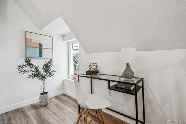 a view of a hallway with seating area