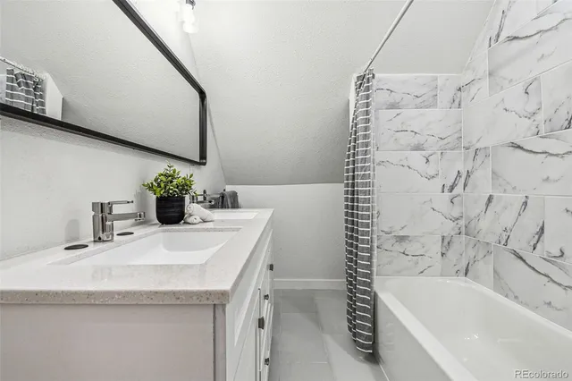 a bathroom with a sink and a bathtub