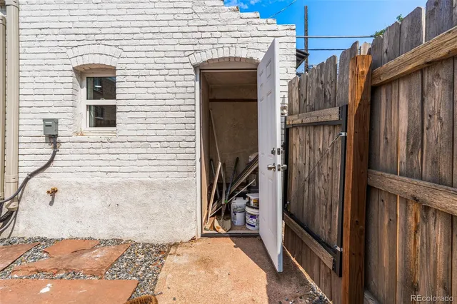 a view of a wooden door of the house
