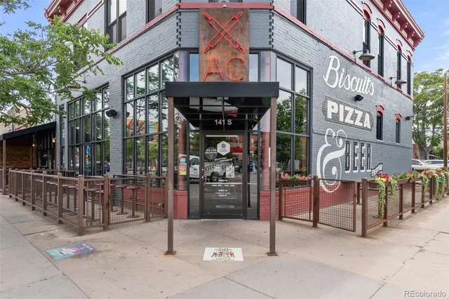 a view of a cafe with sitting area