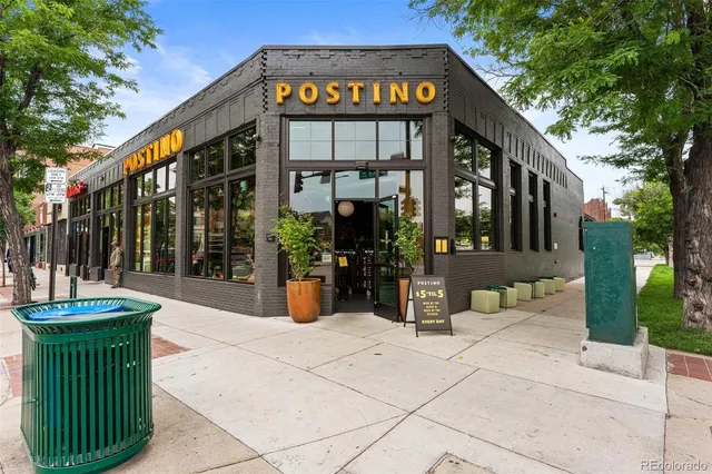 a front view of a house with outdoor seating
