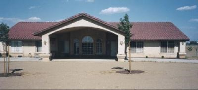 8471 Arrowhead Road, Unit 277 Phelan, CA 92371 - Photo 1 of 1 a front view of a house with a yard