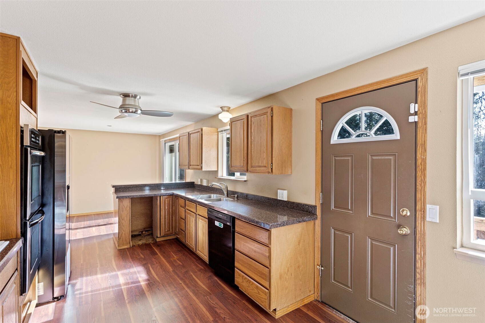 23829 Southeast 208th Street Maple Valley, WA 98038 - Photo 12 of 32 a room with a sink and a stove top oven