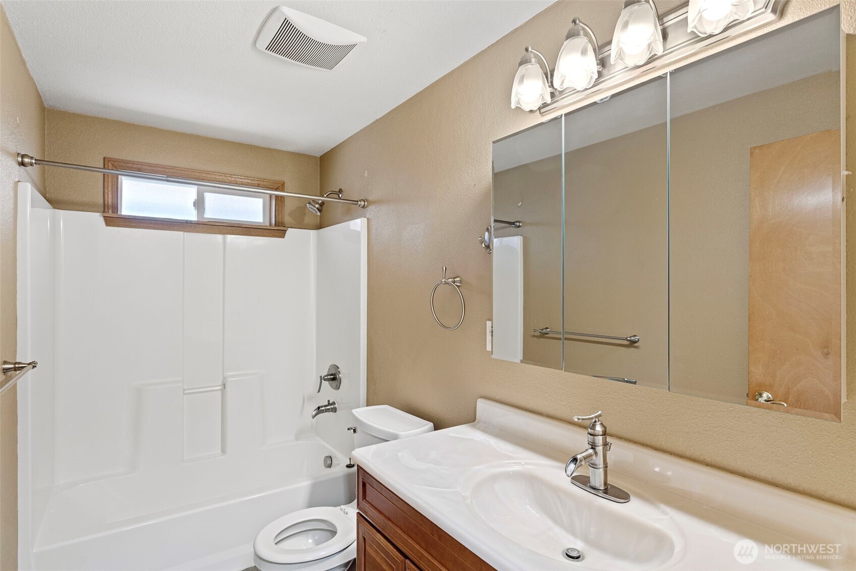 23829 Southeast 208th Street Maple Valley, WA 98038 - Photo 14 of 32 a bathroom with a sink a toilet a mirror and shower
