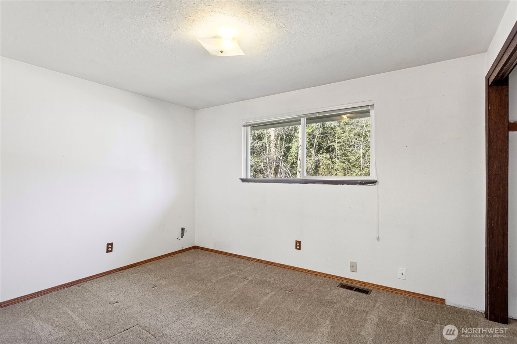 23829 Southeast 208th Street Maple Valley, WA 98038 - Photo 16 of 32 an empty room with a window