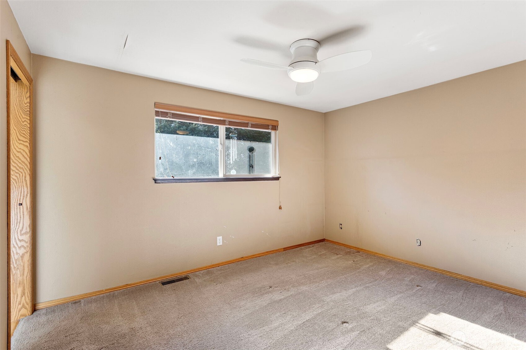 23829 Southeast 208th Street Maple Valley, WA 98038 - Photo 17 of 32 an empty room with a window