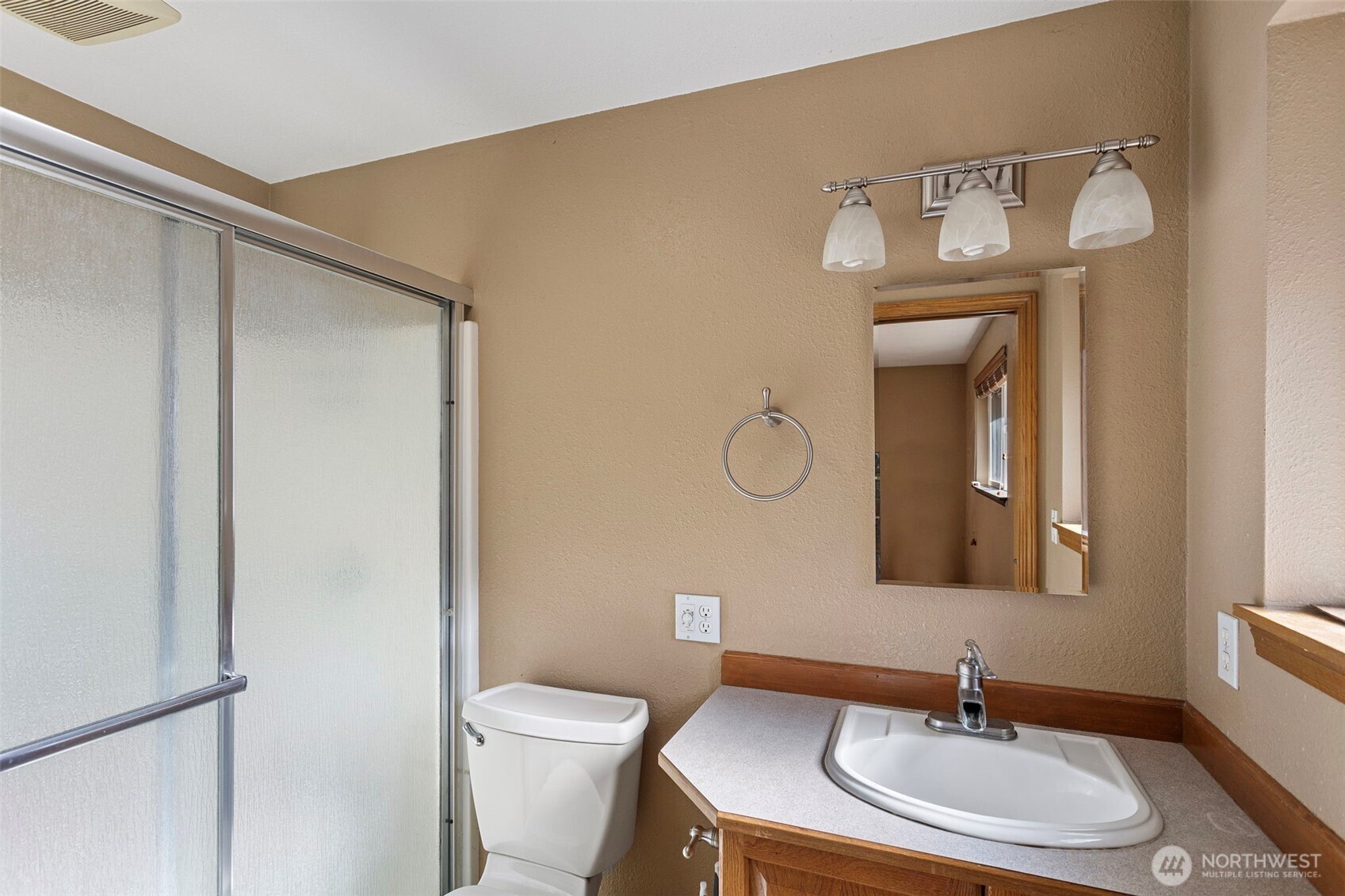 23829 Southeast 208th Street Maple Valley, WA 98038 - Photo 18 of 32 a bathroom with a sink a toilet and a mirror