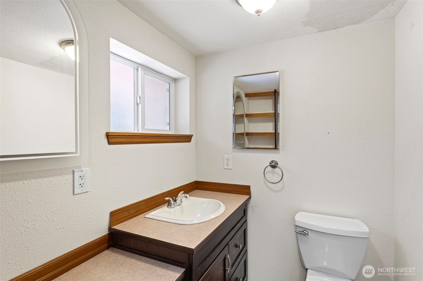 23829 Southeast 208th Street Maple Valley, WA 98038 - Photo 23 of 32 a bathroom with a sink a toilet and a mirror