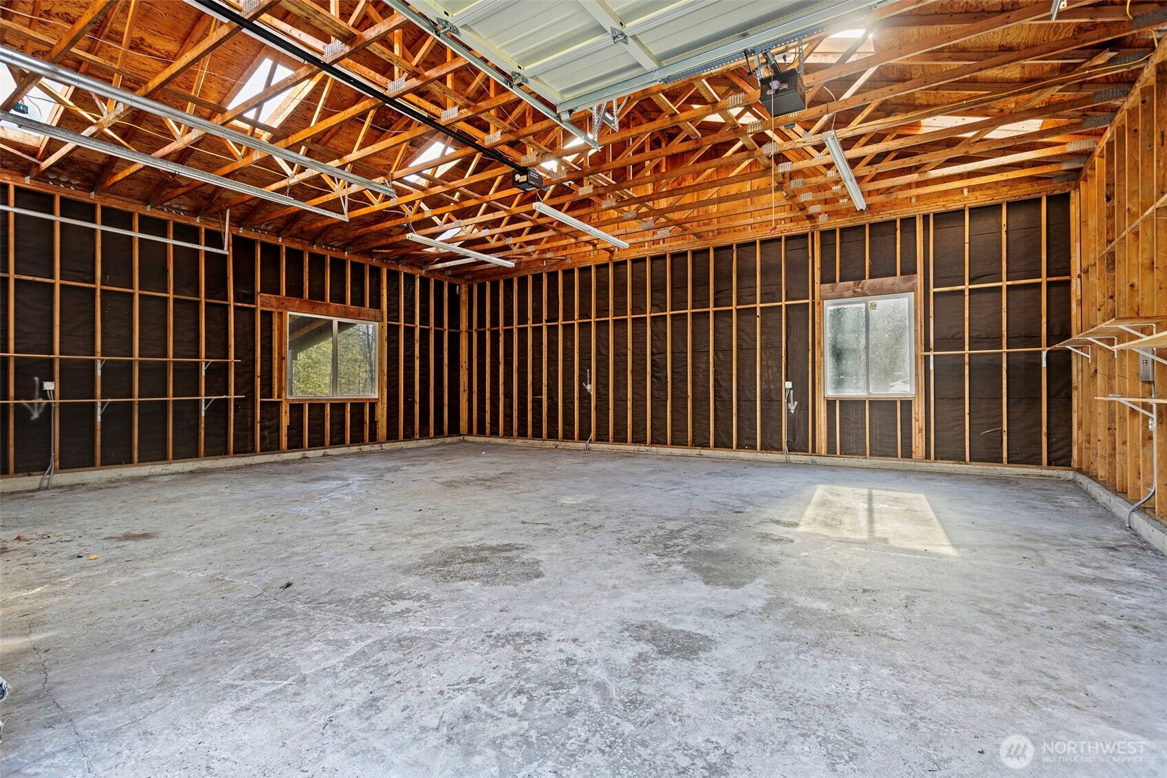23829 Southeast 208th Street Maple Valley, WA 98038 - Photo 28 of 32 a view of an empty room with a garage