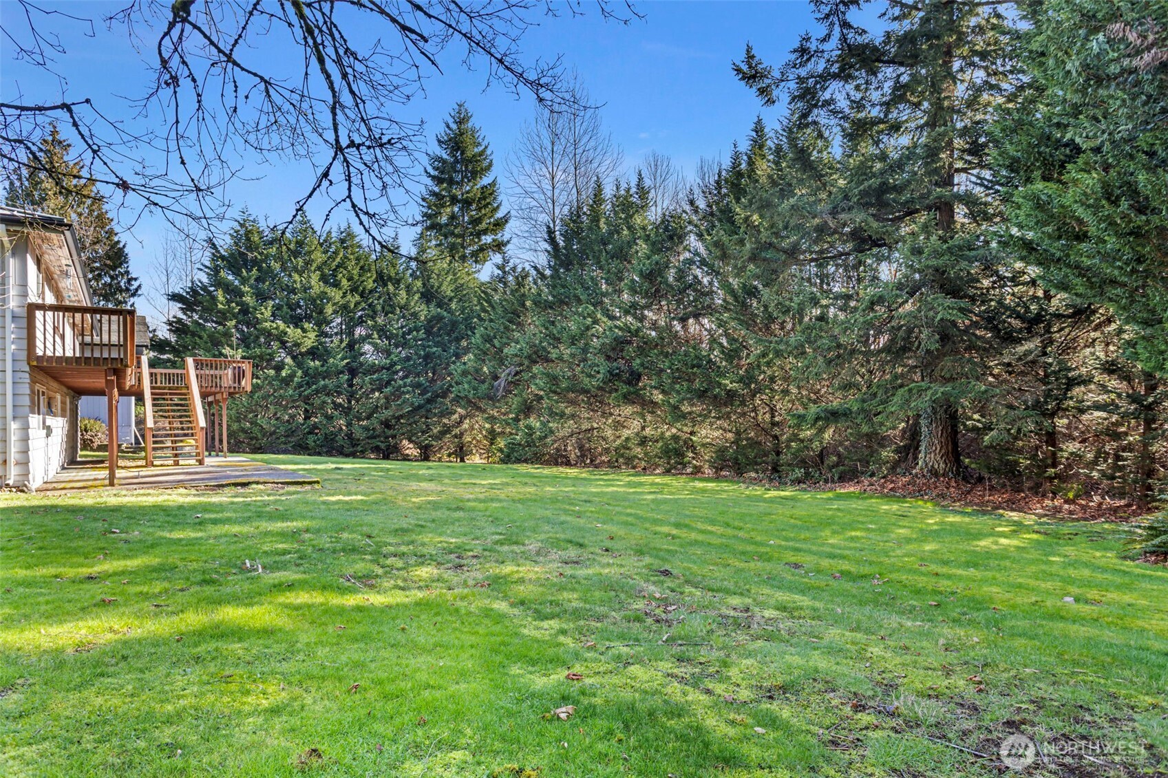 23829 Southeast 208th Street Maple Valley, WA 98038 - Photo 29 of 32 a backyard of a house with lots of green space and fountain