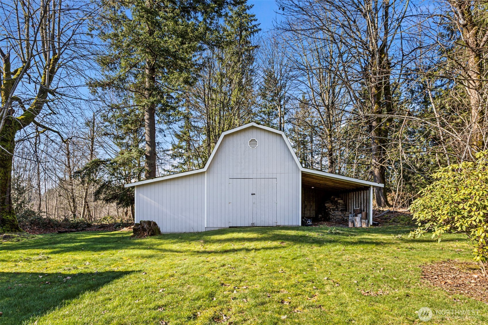 23829 Southeast 208th Street Maple Valley, WA 98038 - Photo 3 of 32 a front view of house with garden