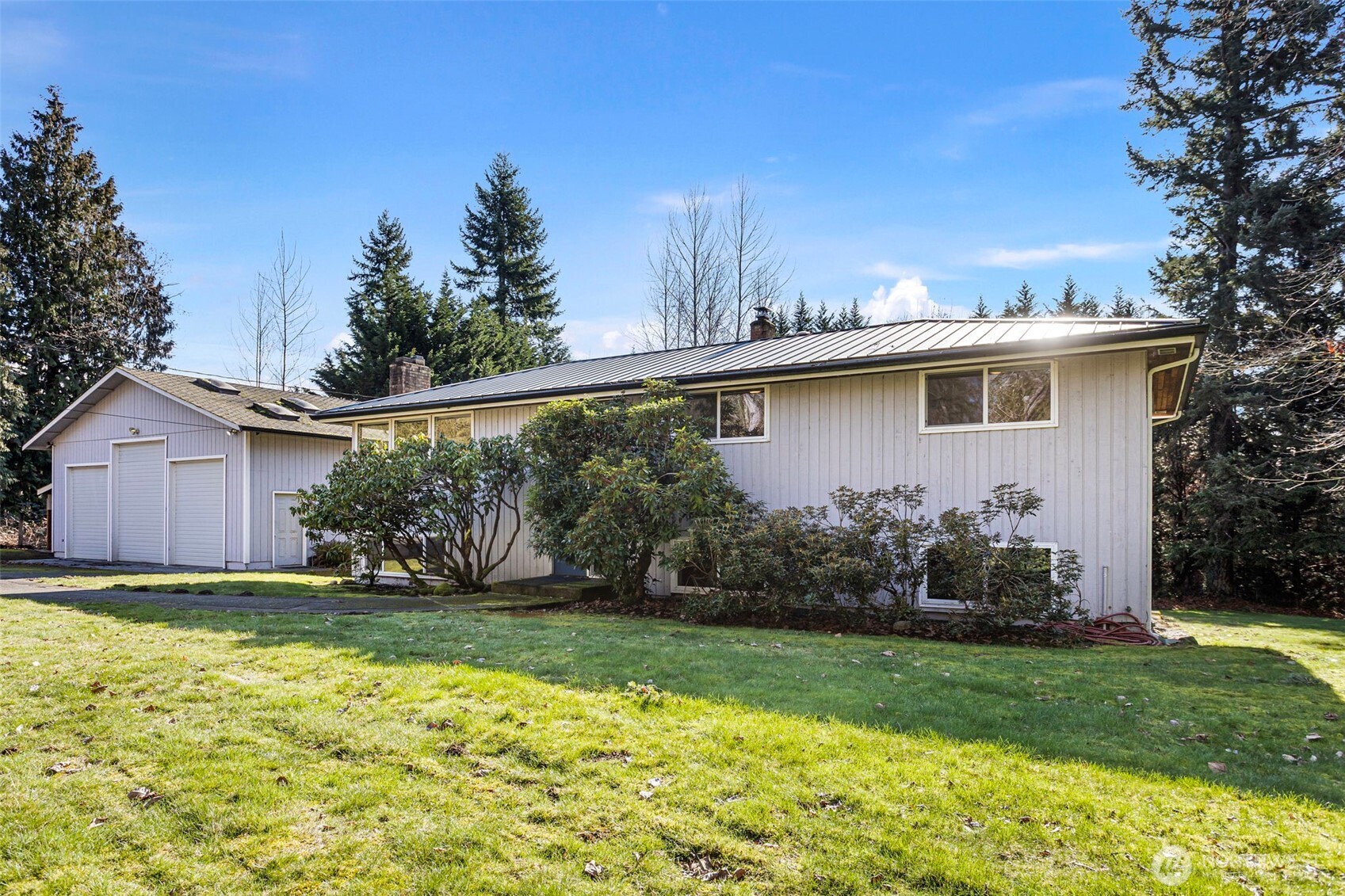 23829 Southeast 208th Street Maple Valley, WA 98038 - Photo 4 of 32 a view of a house with backyard and garden