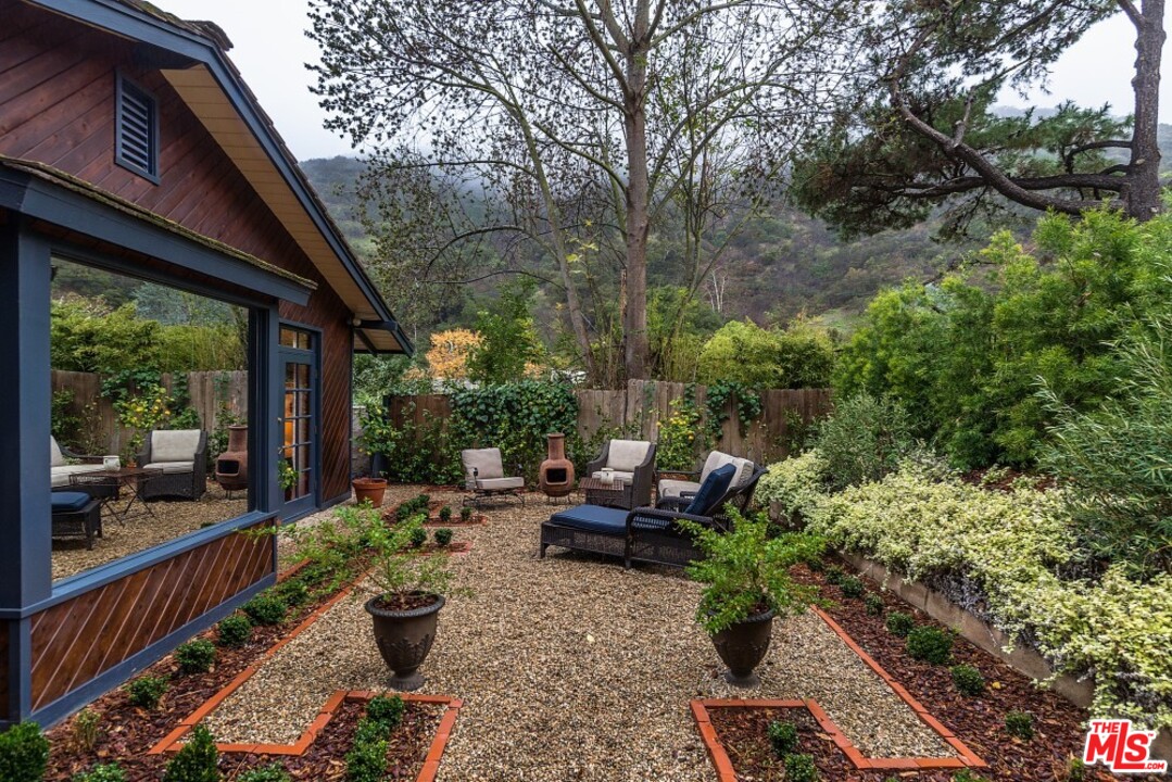 3266 Mandeville Canyon Road Los Angeles, CA 90049 - Photo 23 of 37 a view of garden with patio