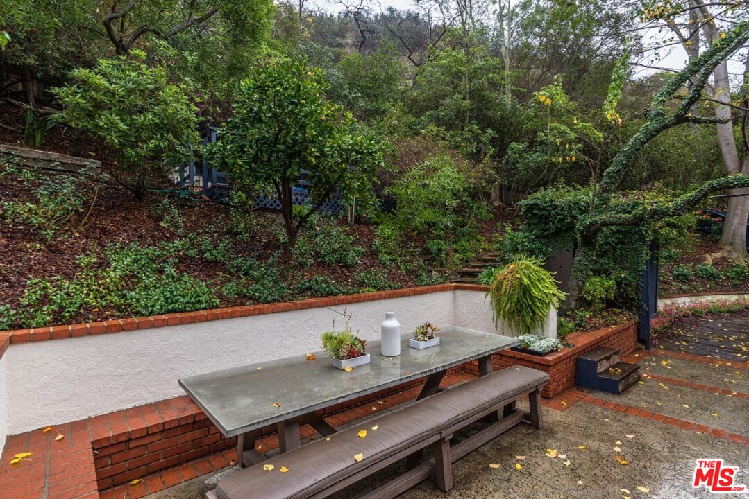 3266 Mandeville Canyon Road Los Angeles, CA 90049 - Photo 36 of 37 a view of a outdoor space with lounge chair
