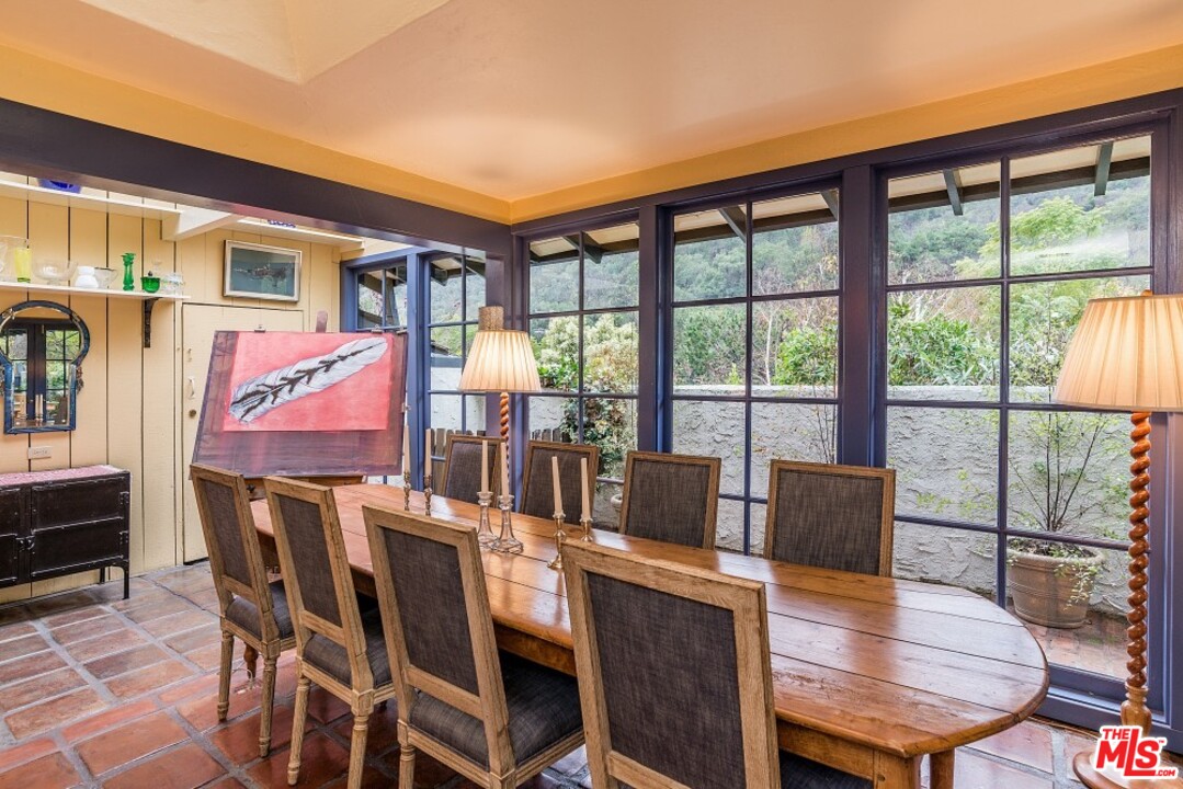 3266 Mandeville Canyon Road Los Angeles, CA 90049 - Photo 10 of 37 a outdoor dining space with furniture and wooden floor