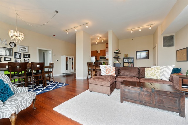 230 West Division Street, Unit 1005 Chicago, IL 60610 - Photo 3 of 15 a living room with furniture and wooden floor