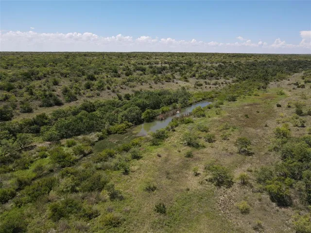 a view of furniture and floor to ceiling window