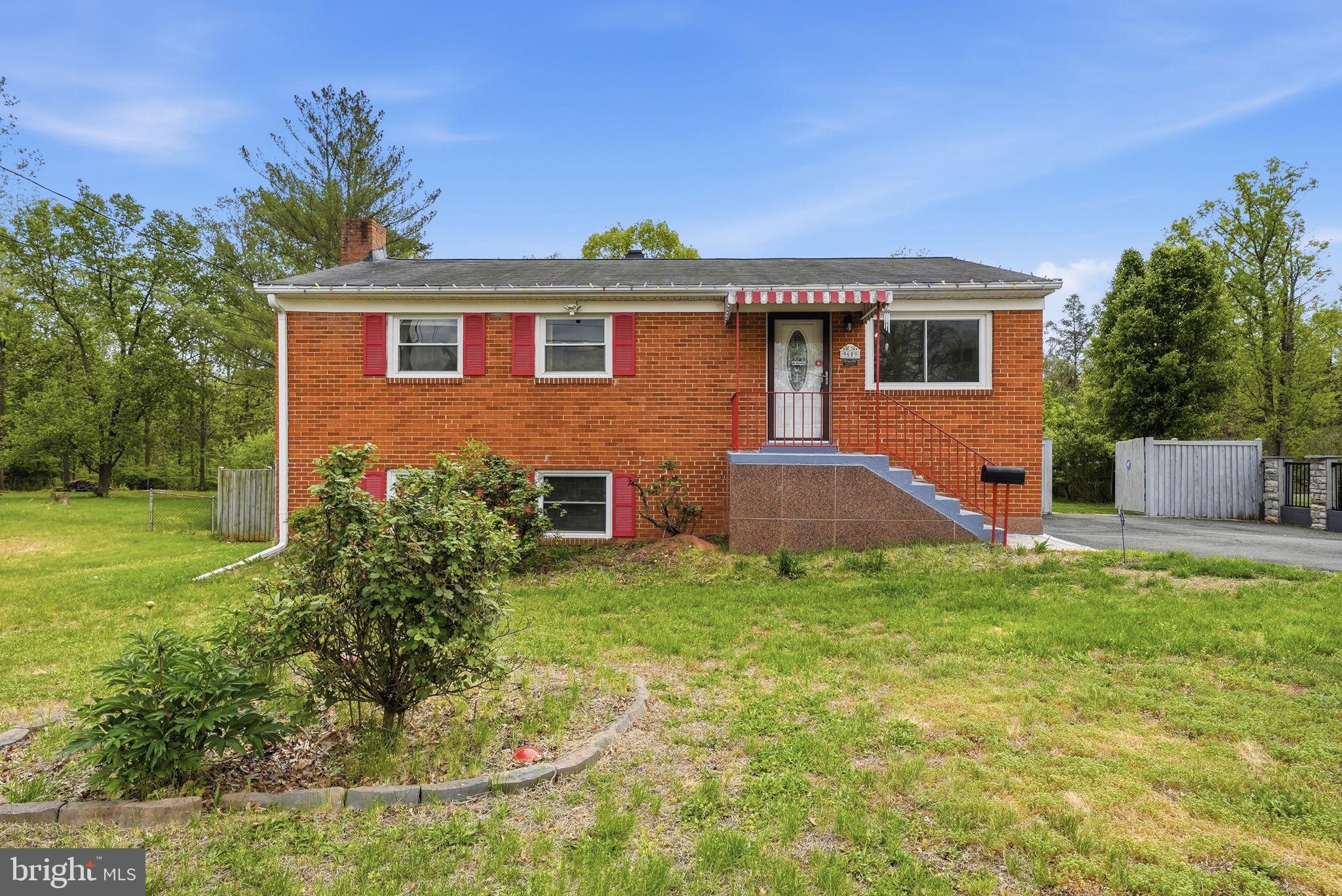 9609 Norfolk Street Manassas, VA 20109 - Photo 14 of 37 a front view of a house with a yard