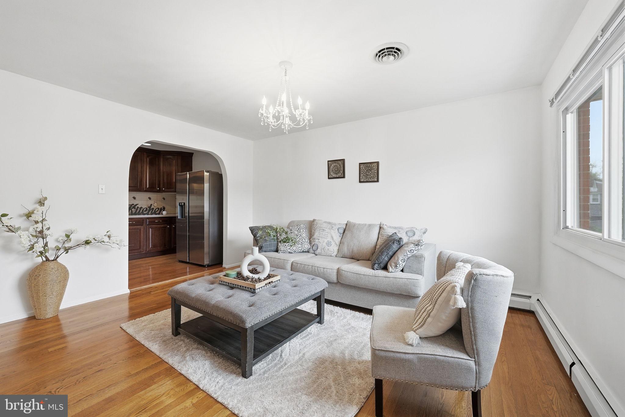 9609 Norfolk Street Manassas, VA 20109 - Photo 17 of 37 a living room with furniture and a chandelier