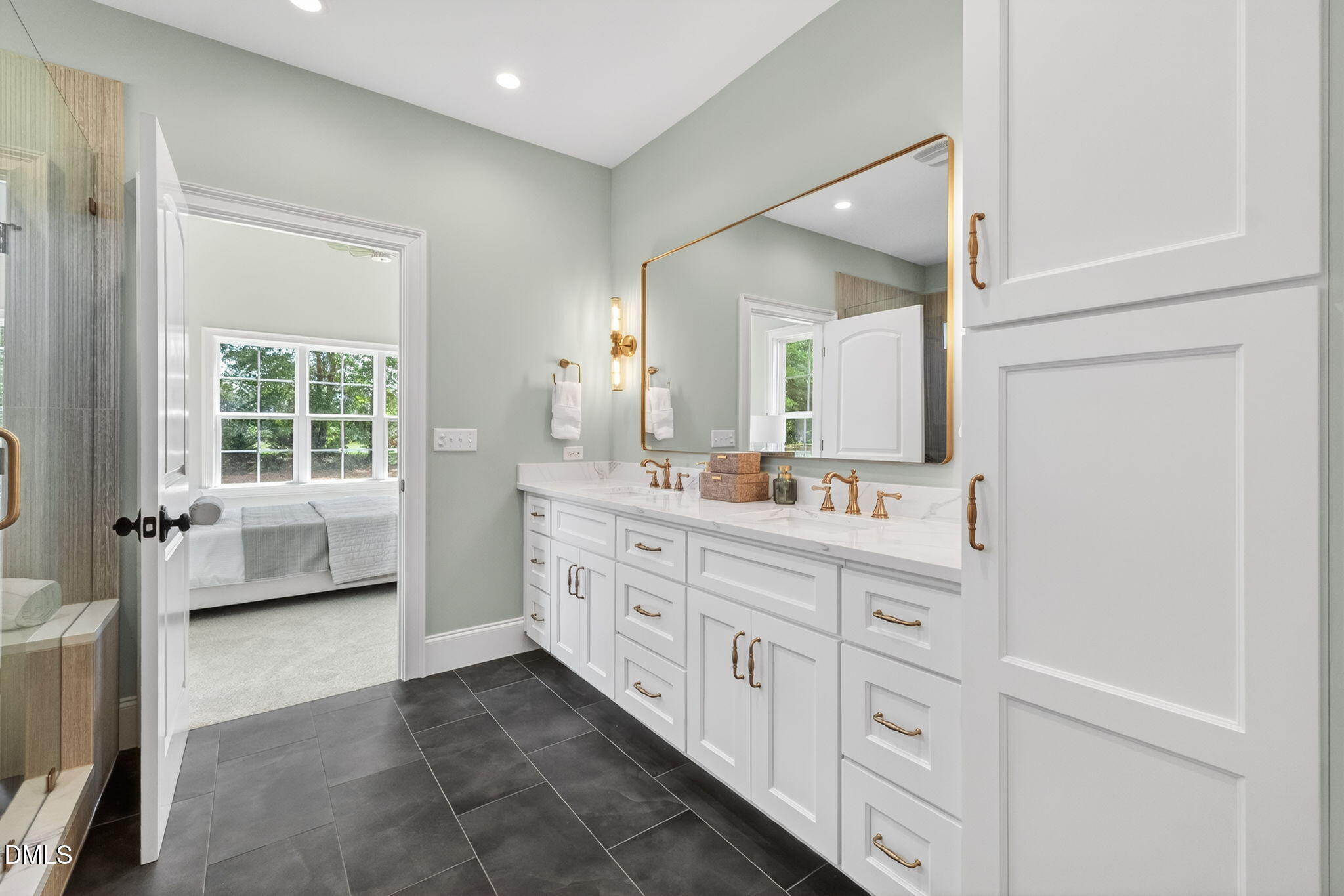 651 Dixon Road, Unit (LOT 2A) Willow Spring, NC 27592 - Photo 19 of 77 a spacious bathroom with a double vanity sink a mirror a bathtub and next to a window