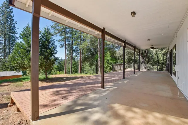 a view of a room with porch and a backyard
