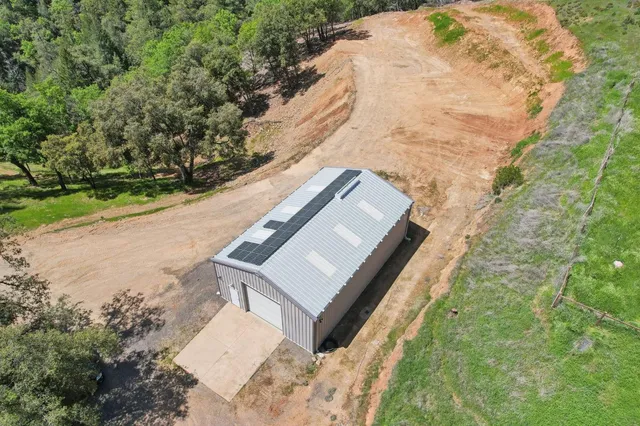 a view of a yard with a bench