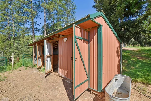 a backyard of a house with a yard and outdoor seating