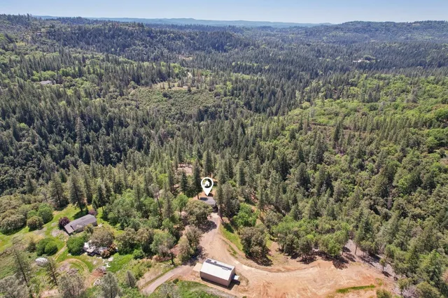 an aerial view of residential house with outdoor space