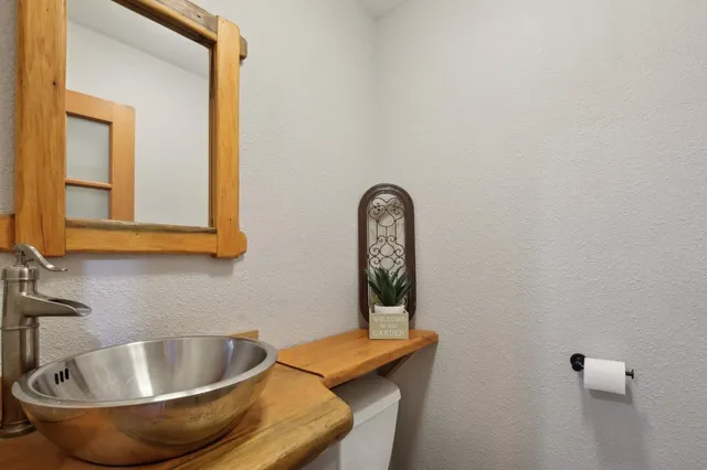 a bathroom with a tub and a sink