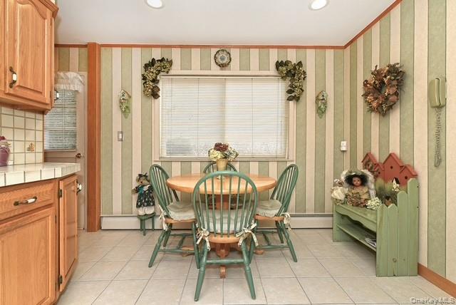 8 Brookstan Road Nesconset, NY 11767 - Photo 11 of 35 a dining room filled with furniture and a window