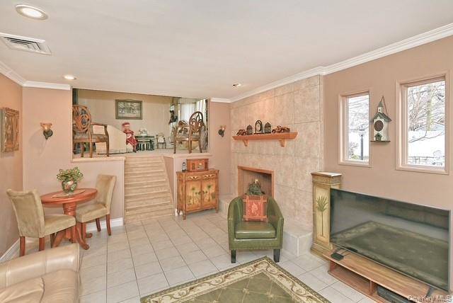 8 Brookstan Road Nesconset, NY 11767 - Photo 16 of 35 a living room with furniture and a fireplace