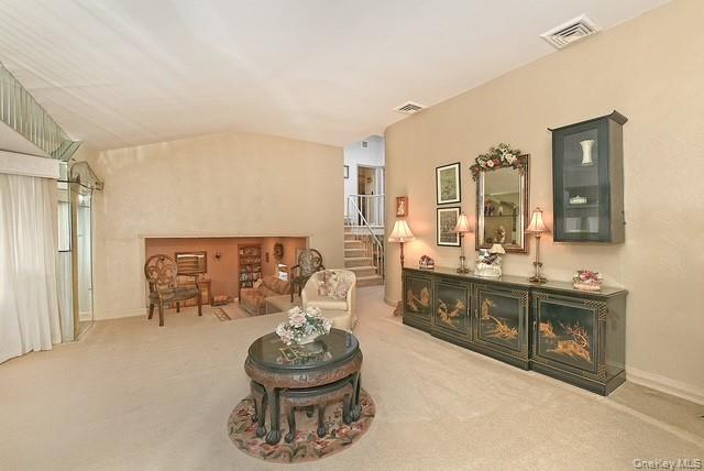 8 Brookstan Road Nesconset, NY 11767 - Photo 18 of 35 a living room with furniture and a wooden floor