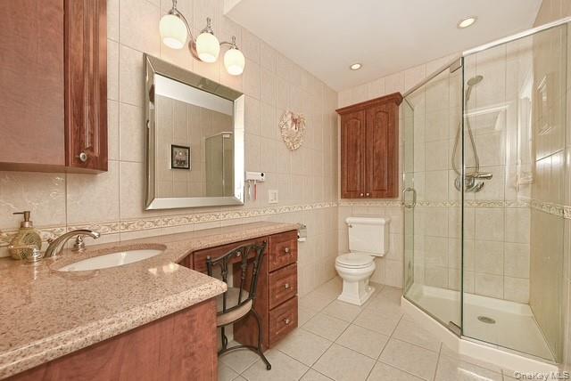 8 Brookstan Road Nesconset, NY 11767 - Photo 22 of 35 a bathroom with a granite countertop sink toilet and shower