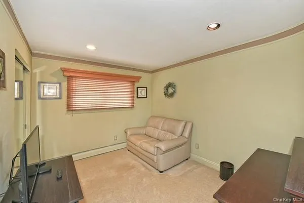 a view of entryway with furniture and wooden floor
