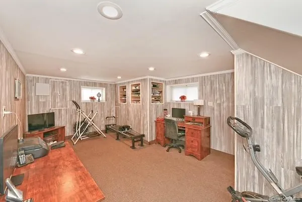 a front view of house with yard and outdoor seating