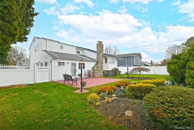 8 Brookstan Road Nesconset, NY 11767 - Photo 28 of 35 a view of a house with a yard and sitting area