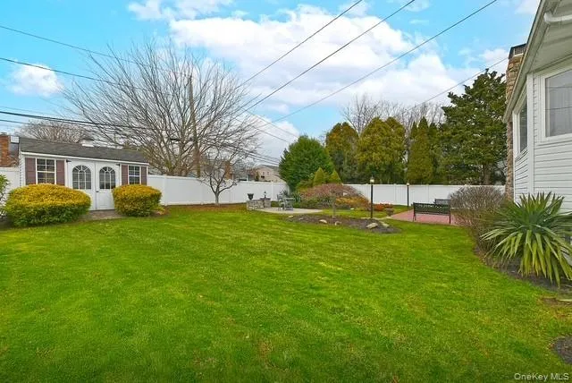 an aerial view of a house with yard swimming pool and outdoor seating