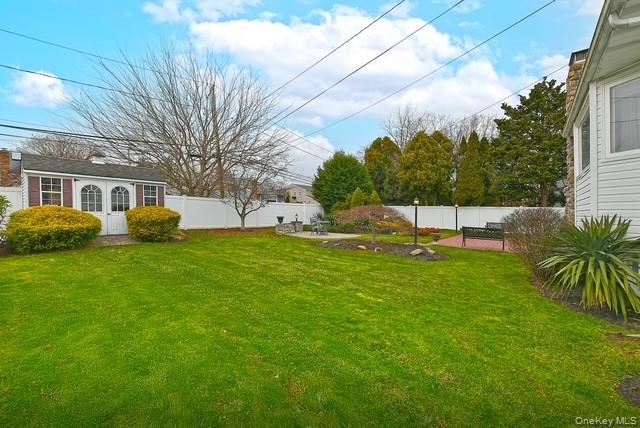 8 Brookstan Road Nesconset, NY 11767 - Photo 32 of 35 a view of a house with a backyard