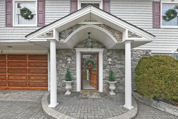 a view of a hallway with a furniture and a window