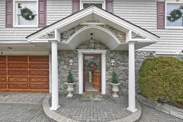 a view of a hallway with a furniture and a window