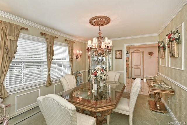 8 Brookstan Road Nesconset, NY 11767 - Photo 9 of 35 a view of a dining room with furniture and chandelier