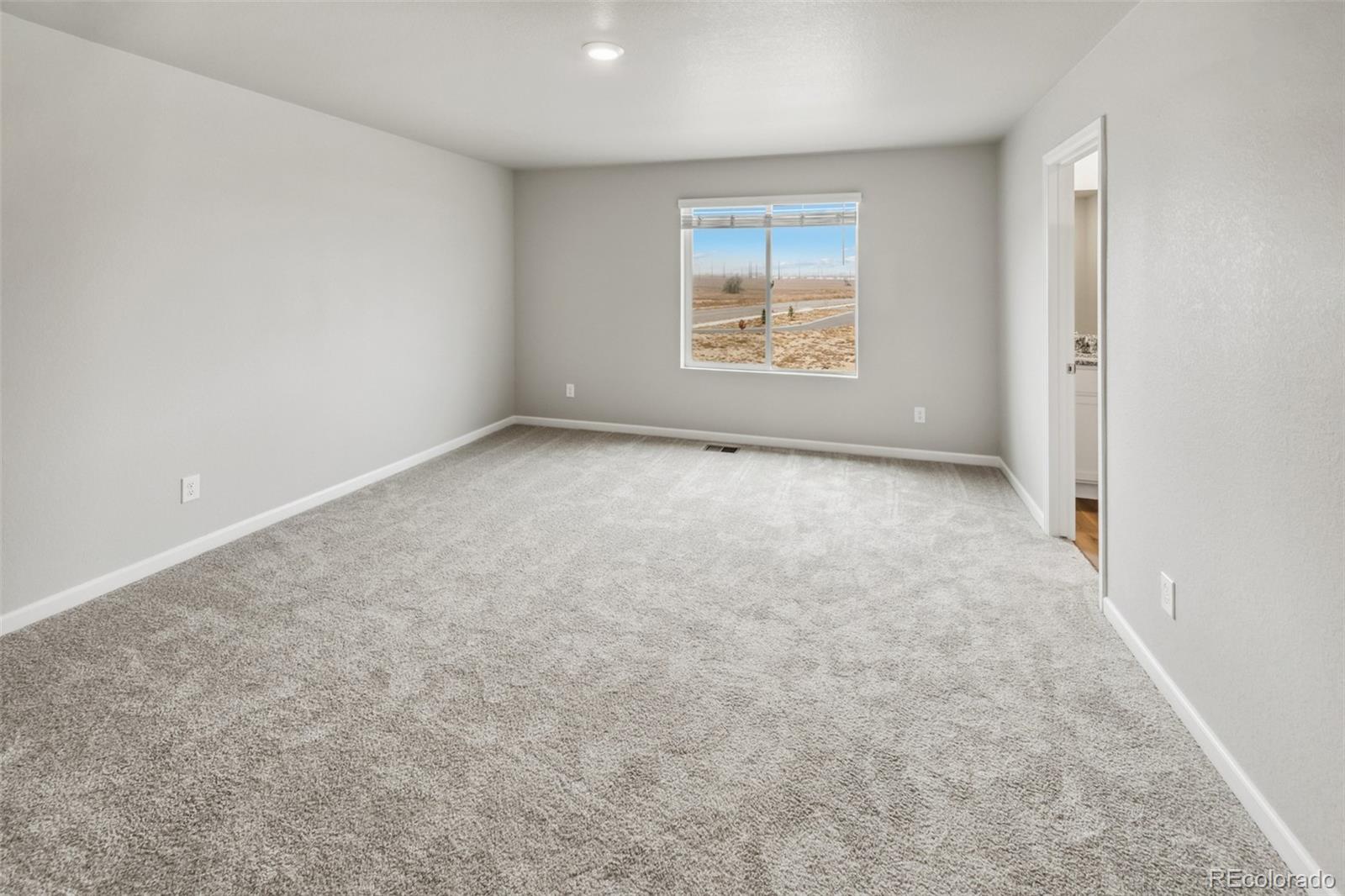 2220 Christina Street Fort Lupton, CO 80621 - Photo 11 of 42 an empty room with windows