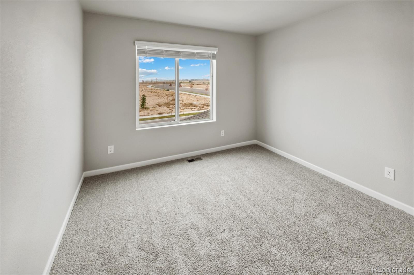 2220 Christina Street Fort Lupton, CO 80621 - Photo 16 of 42 an empty room with a window