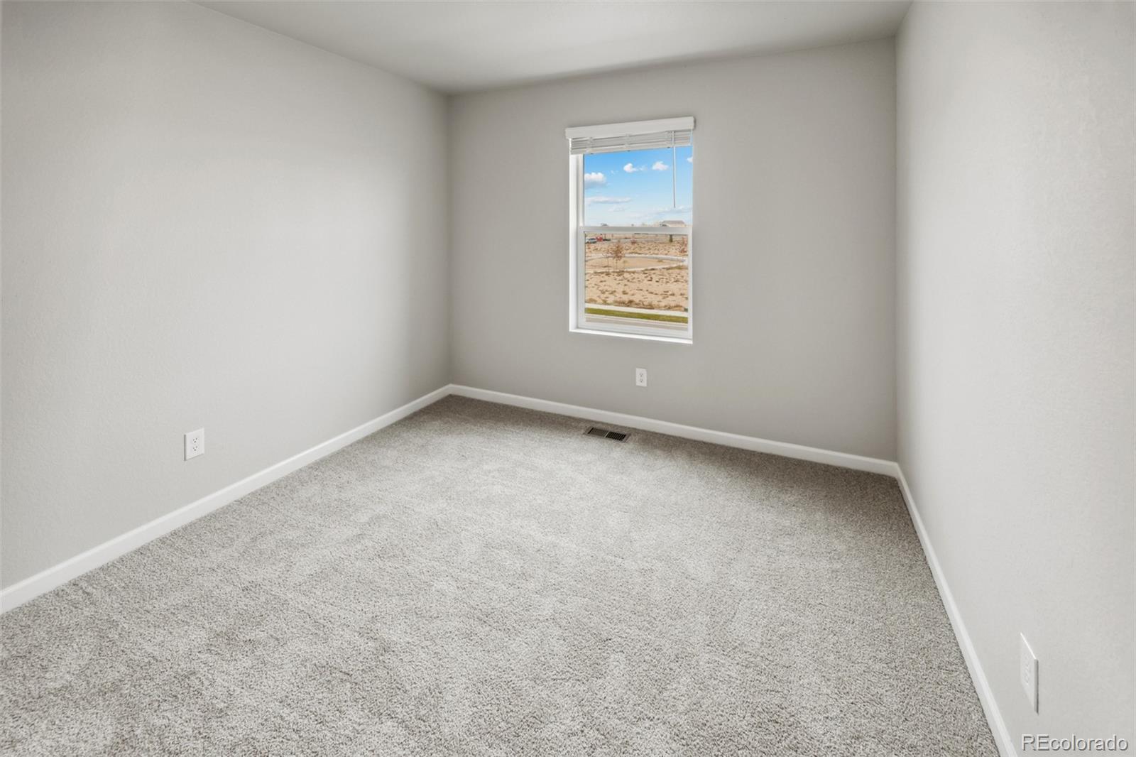2220 Christina Street Fort Lupton, CO 80621 - Photo 17 of 42 an empty room with a window