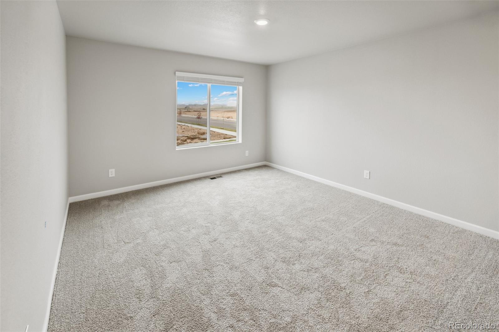 2220 Christina Street Fort Lupton, CO 80621 - Photo 10 of 42 an empty room with windows