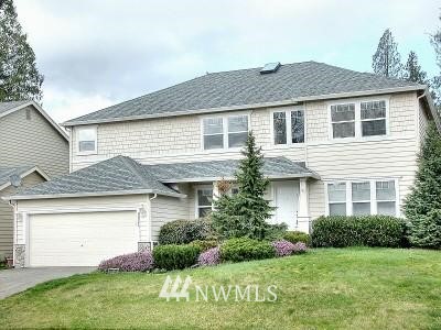 17544 Southeast 186th Way Renton, WA 98058 - Photo 1 of 1 a front view of a house with a yard and garage