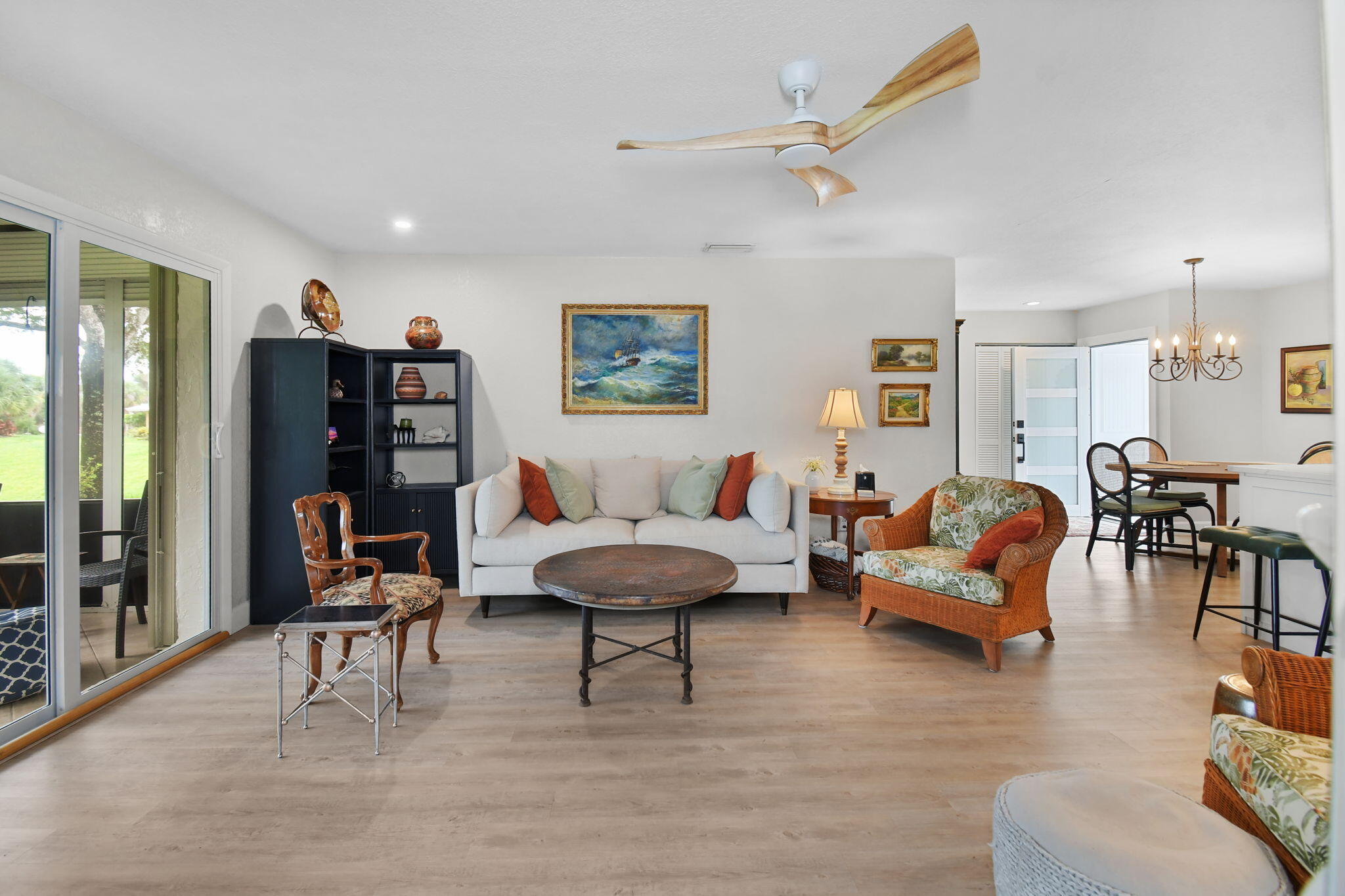 5251 Southeast Sea Island Way Stuart, FL 34997 - Photo 16 of 68 a living room with furniture and a lamp