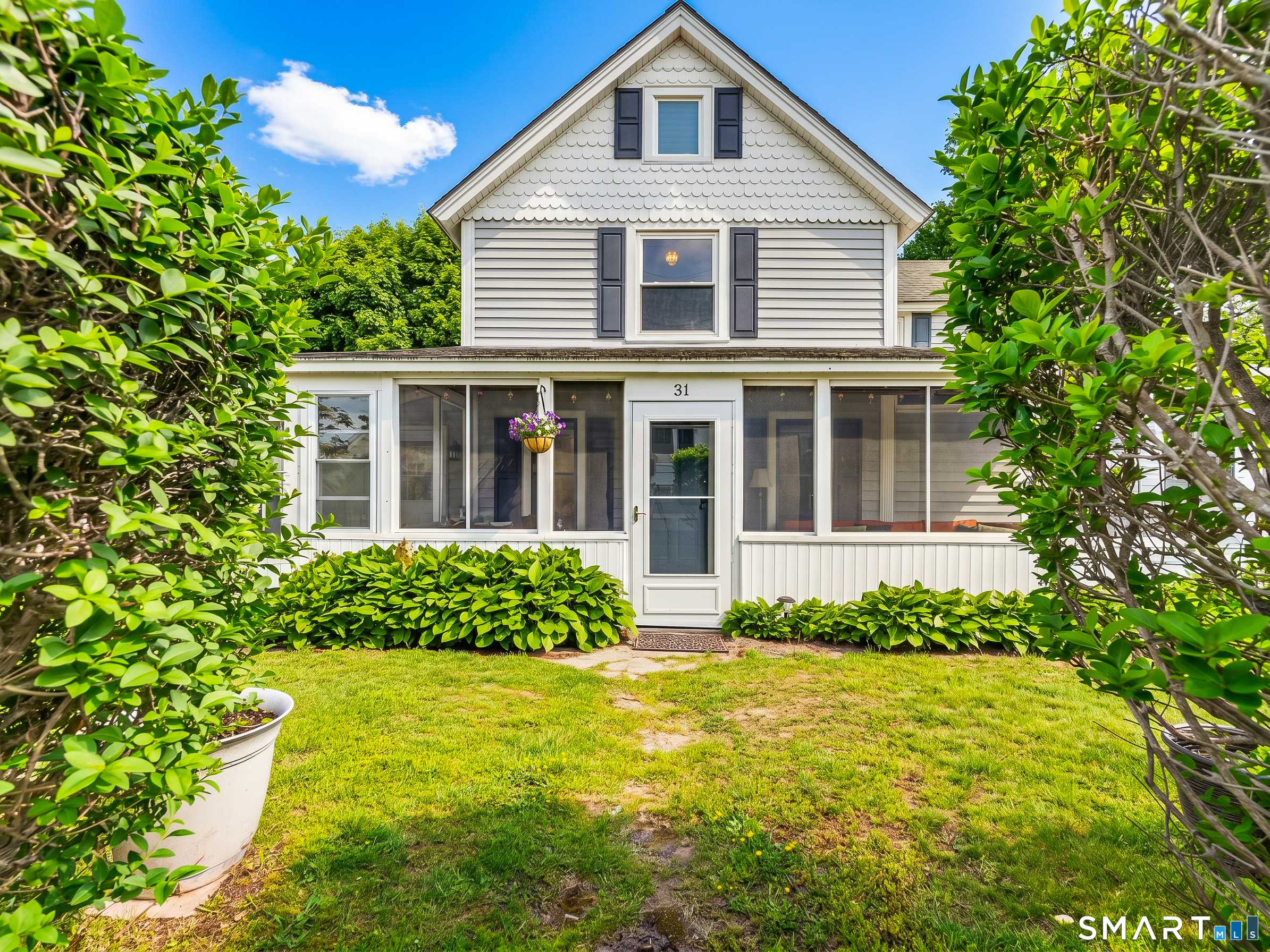 31 Old Colony Road Old Lyme, CT 06371 - Photo 4 of 38 a front view of a house with a yard